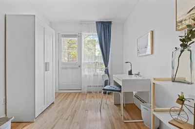 a white room with a desk and a window at Large Beautiful 2BR Apartment fully equipped in Montréal