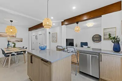 a kitchen and dining room with a table and chairs at Large Beautiful 2BR Apartment fully equipped in Montréal