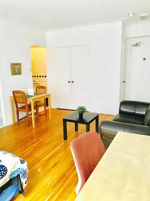 a living room with a couch and a table at Stylish Montreal Apartment: Comfortable Stay in the Golden Square Mile in Montréal