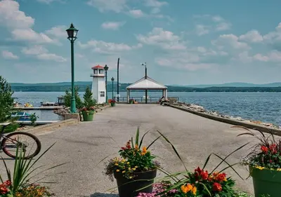 a dock with a gazebo next to the water at chalet Ani in Piopolis
