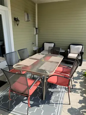a table and chairs sitting on a patio at Superbe condo - Navette de Ski Gratuite #102 in Bromont