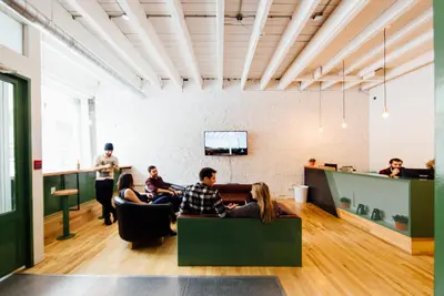 a group of people sitting in a room at Alt Hostel in Montréal