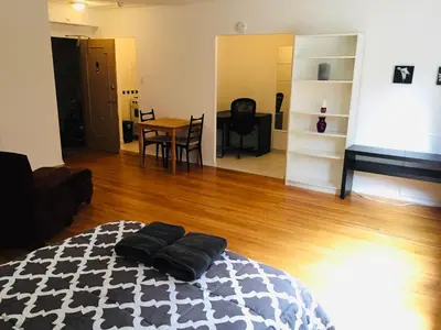 a room with a bed with two pillows on it at Stylish Montreal Apartment: Comfortable Stay in the Golden Square Mile in Montréal