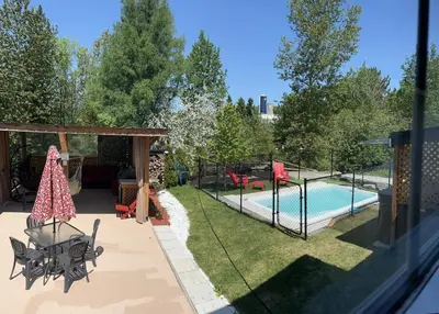 a backyard with a swimming pool and a playground at Le Studio CITQ3O1849 in Saint Pierre de Broughton