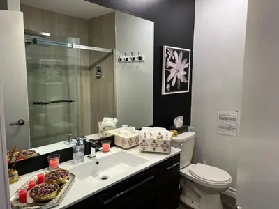 a bathroom with a sink and a toilet at Condo Phoenix prés du Lac Memphrémagog. in Magog-Orford