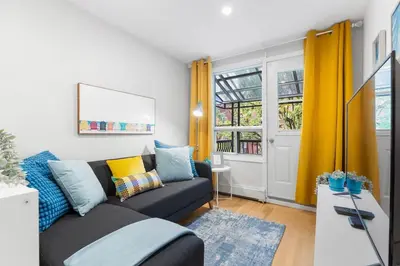 a living room with a couch and a window at Charming 1 BR Apartment cozy and fully equipped in Montréal