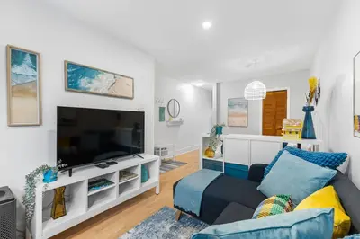 a living room with a couch and a flat screen tv at Charming 1 BR Apartment cozy and fully equipped in Montréal