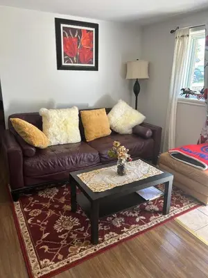a living room with a couch and a coffee table at Havre de paix in Laval