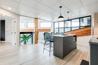 an office with a desk and chairs in a room at Complexe La Voûte by Gestion ELITE in Laval