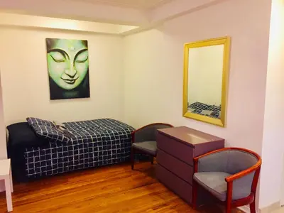 a bedroom with a bed and a mirror at Stylish Montreal Apartment: Comfortable Stay in the Golden Square Mile in Montréal