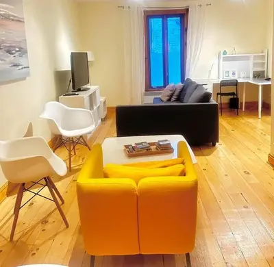 a living room with a couch and a table at Best Monthly Deal - Plateau Apt - Top location in Montréal