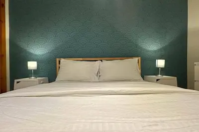 a bedroom with a bed with a green wall at Best Monthly Deal - Plateau Apt - Top location in Montréal