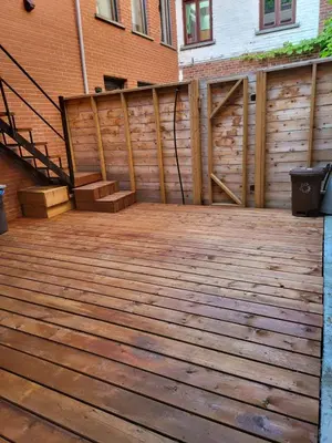 a wooden deck with stairs and a fence at Best Monthly Deal - Plateau Apt - Top location in Montréal