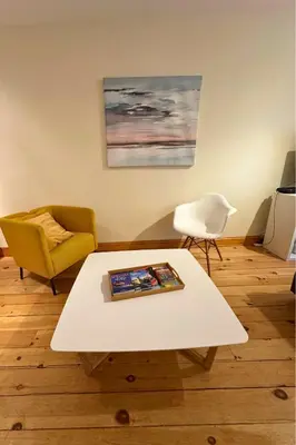 a living room with a coffee table and a chair at Best Monthly Deal - Plateau Apt - Top location in Montréal