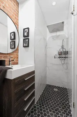 a bathroom with a sink and a mirror at Luxurious Old Montreal Parking Patio 10 Guests in Montréal