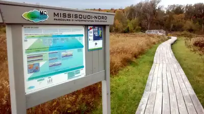 a sign at the end of a boardwalk at Le Sunset in Eastman