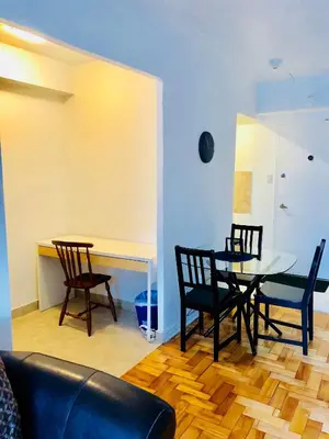 a dining room with a table and chairs at Stylish Montreal Apartment: Comfortable Stay in the Golden Square Mile in Montréal