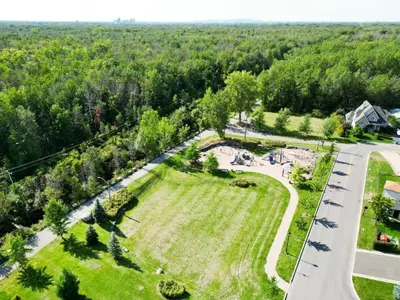 an aerial view of a park with a road at L'Oasis Urbaine in Saint-Hubert