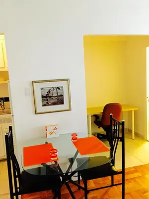 a dining room with a glass table and chairs at Stylish Montreal Apartment: Comfortable Stay in the Golden Square Mile in Montréal