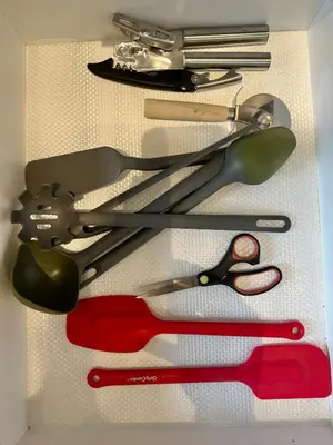 a group of scissors and other tools on a table at Appartment 2BR 4 beds AC wi-Fi Smart TV FreeParking in Laval