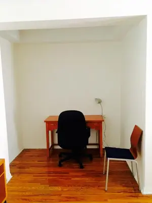 an office with a desk and a chair and a chair at Stylish Montreal Apartment Comfortable Stay in the Golden Square Mile in Montréal