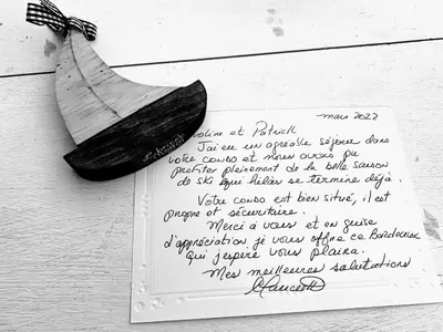 a piece of paper with a letter on a wall at OMagogcondo com A in Magog-Orford
