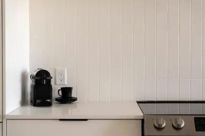 a coffee maker sitting on a counter in a kitchen at Maison Place Jacques-Cartier by Luxury In Transit in Montréal