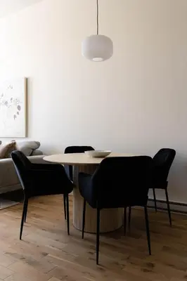 a dining room with a table and chairs at Maison Place Jacques-Cartier by Luxury In Transit in Montréal
