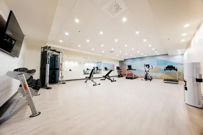 a gym with treadmills and machines in a room at Candlewood Suites Trois-Rivières Ouest by IHG in Trois-Rivières
