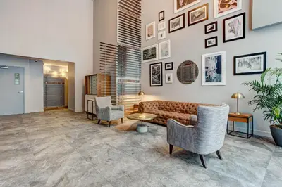 a living room with a couch and chairs at The Downtown Zando in Montréal