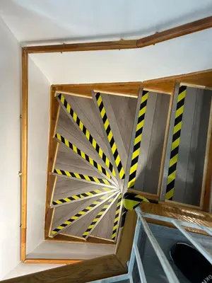 a window with yellow and black caution tape at 2 Bedrooms, 1 Sofa bed and 1,5 Bathrooms, Renovated Apartment in the Heart of Plateau Mont-Royal in Montréal