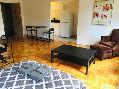 a living room with a coffee table and a couch at Stylish Montreal Apartment in Montréal