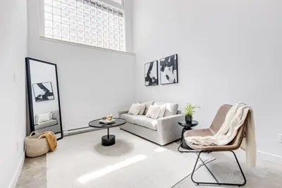 a living room with a couch and a chair at Le Mile End by M11 - Modern Luxe 1BDR with Sofa Bed in Montréal