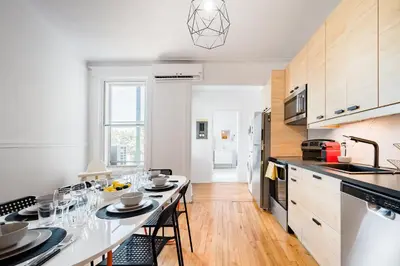 a kitchen with a table with glasses on it at Frontenac residences in Montréal