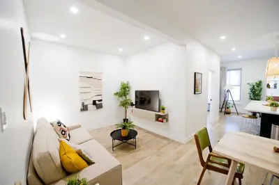 a living room with a couch and a table at Frontenac residences in Montréal