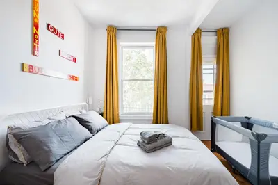 a bedroom with a bed and a window at Frontenac residences in Montréal