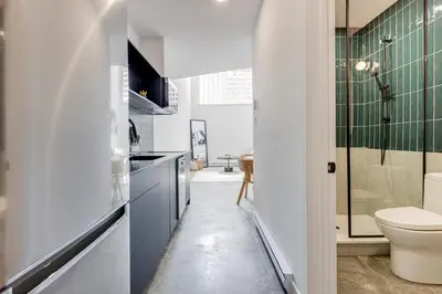 a bathroom with a toilet and a sink at Le Mile End by M11 - Luxurious Two-Floor 1BDR Loft in Montréal