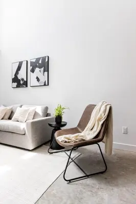 a living room with a couch and a chair at Le Mile End by M11 - Luxurious Two-Floor 1BDR Loft in Montréal