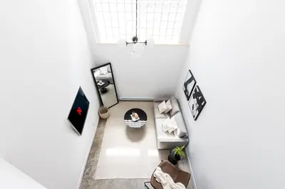 an overhead view of a living room with a couch at Le Mile End by M11 - Luxurious Two-Floor 1BDR Loft in Montréal