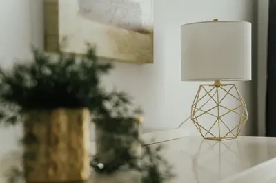 a lamp sitting on a table next to a plant at New Spacious and Cozy 2bdr Apartment in Montréal