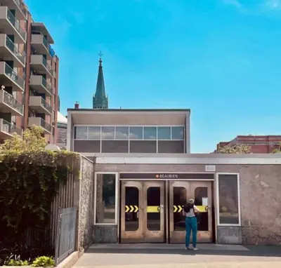 a person standing in front of a building at New Spacious and Cozy 2bdr Apartment in Montréal