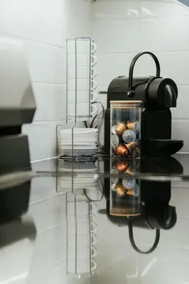 a glass table with a tray of muffins on it at Welcoming and Light Filled 2bdr Apartment in Montréal