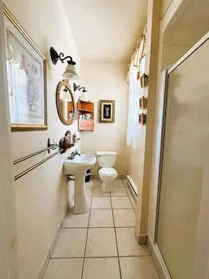 a bathroom with a toilet and a sink at Ô Café Crème in Magog-Orford
