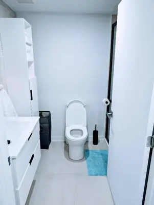 a bathroom with a toilet and a sink at Cozy Studio in Montreal's Quartier des Spectacles in Montréal