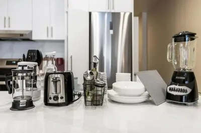 a kitchen counter with appliances on a counter top at Luxe DownTown King Suite in Montréal