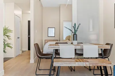 a dining room with a table and chairs at Downtown 2BR Suite in Montréal