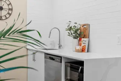 a kitchen with a sink and a counter top at City Center 2BR Condo in Montréal
