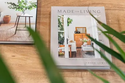 a book on making a living sitting on a table at DownTown King Suite with Balcony in Montréal
