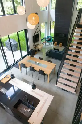 an aerial view of a living room with a staircase at Pur Nature et Spa Owl's Head in Mansonville