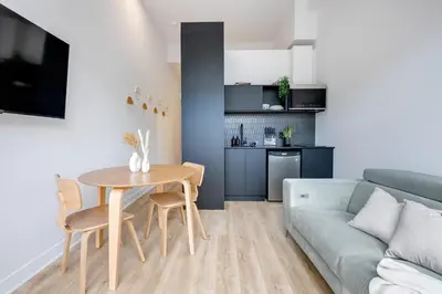 a living room with a couch and a table at Le Mile End by M11 - Luxurious & Cozy 1BDR Unit in Montréal